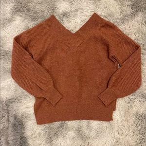 Burnt orange off the shoulders sweater.